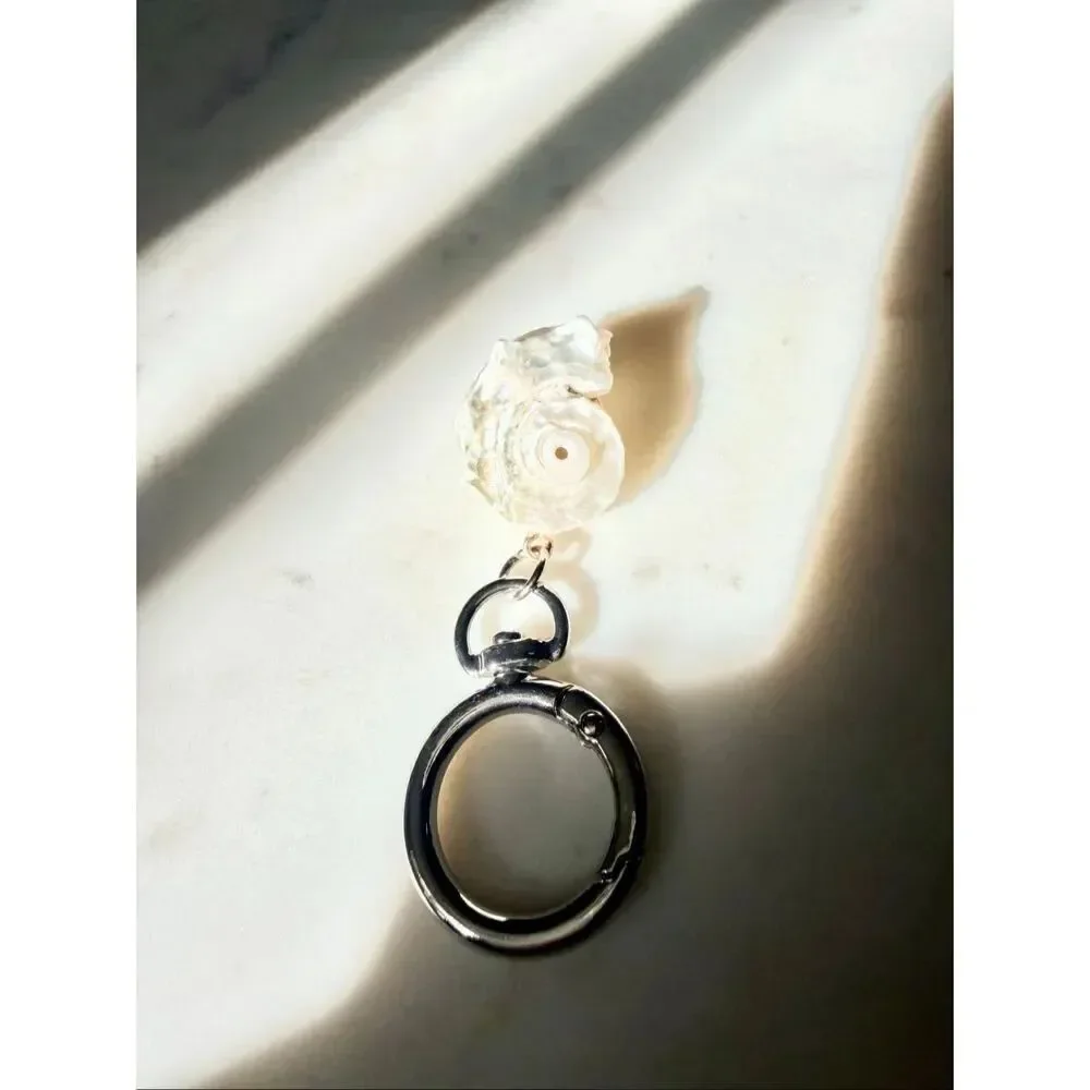 Pearlescent with silver color seashell keychain